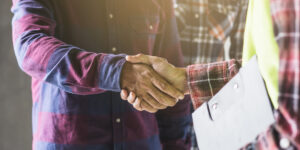 shaking hands with a construction worker