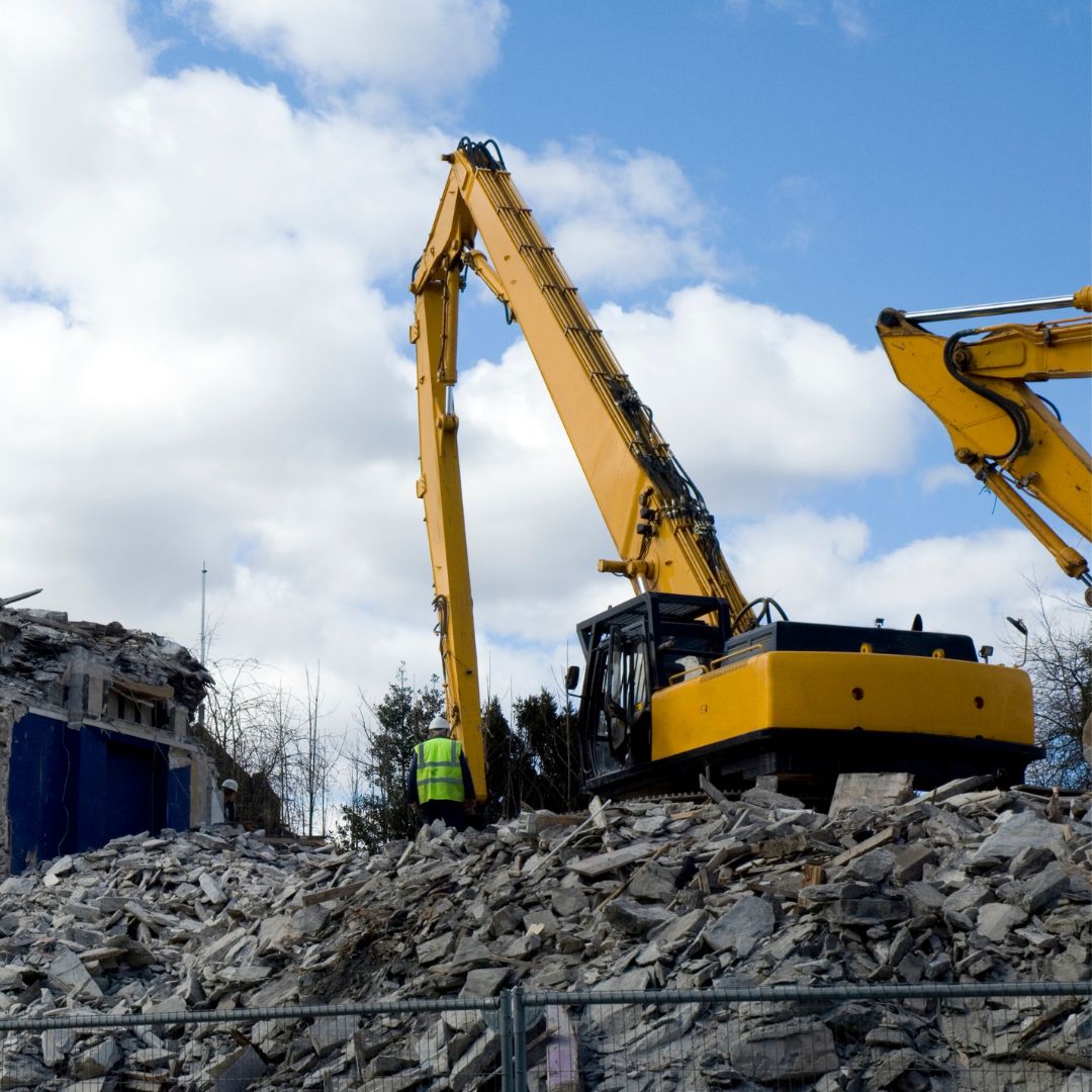 heavy machinery on rubble pile