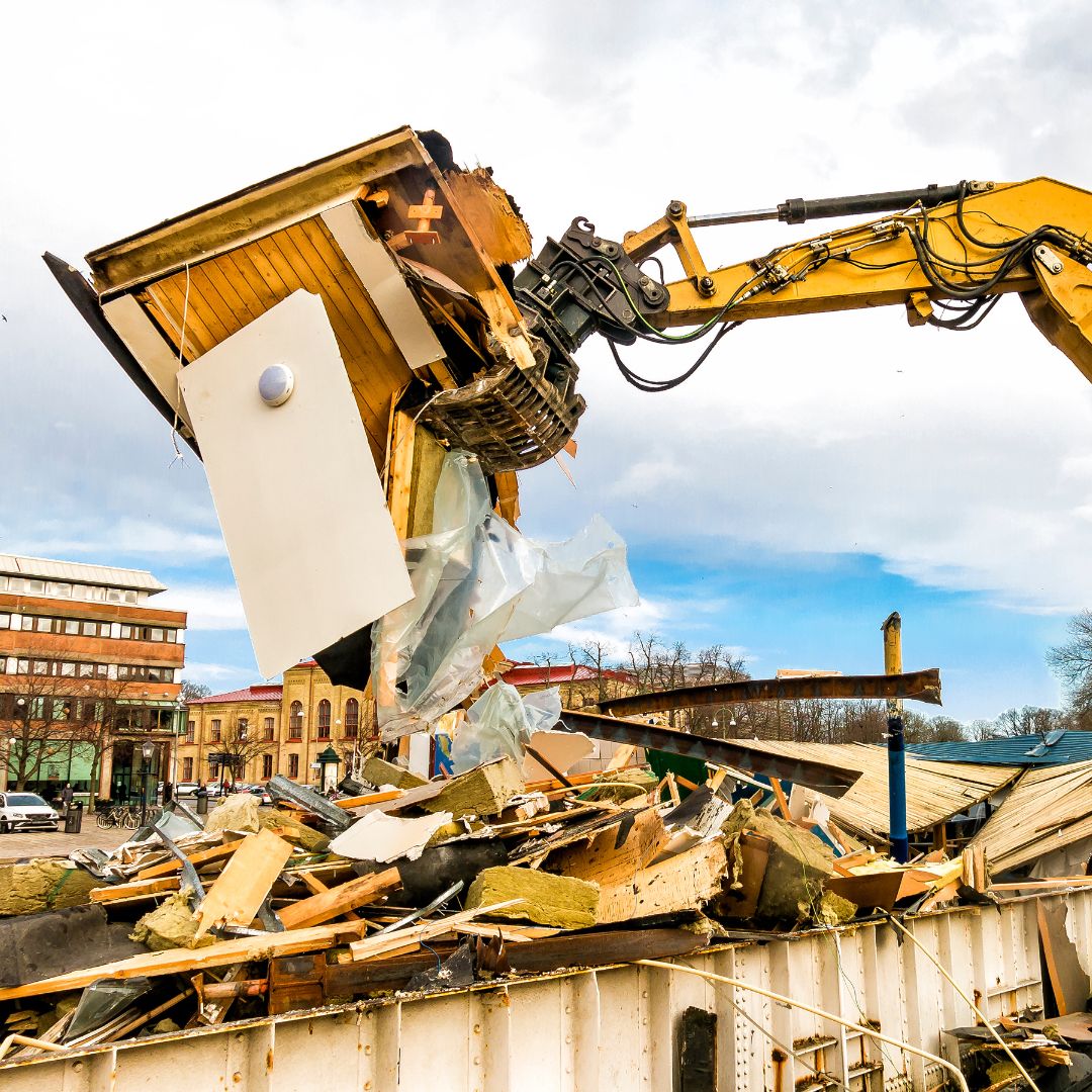 heavy machinery demolishing building