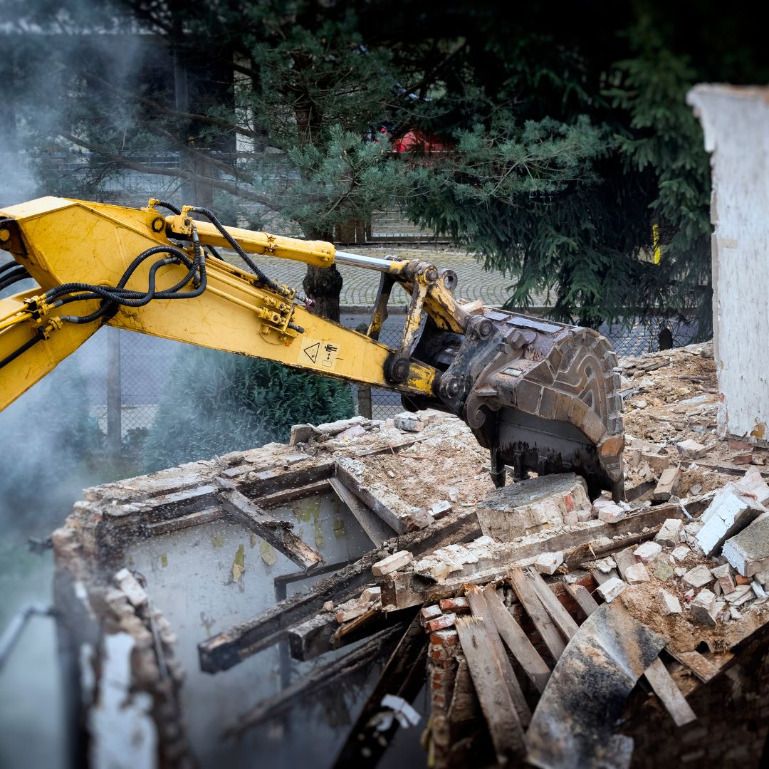 Demolition equipment demolishing a house.
